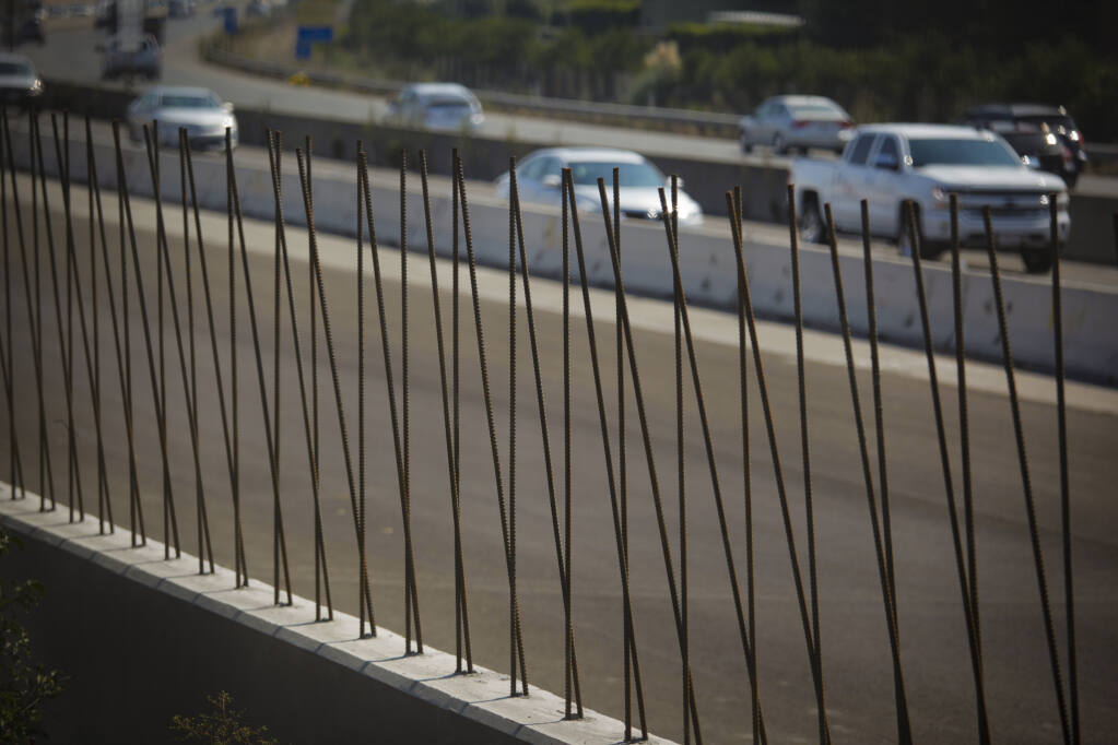 Construction on a sound wall continues in September 2020 near the Washington Street exit of Highway 101. Hundreds of redwood trees were also cut down as part of erecting more than 7 miles of sound wall along both sides of Highway 101 in Petaluma. (CRISSY PASCUAL/ARGUS-COURIER STAFF)