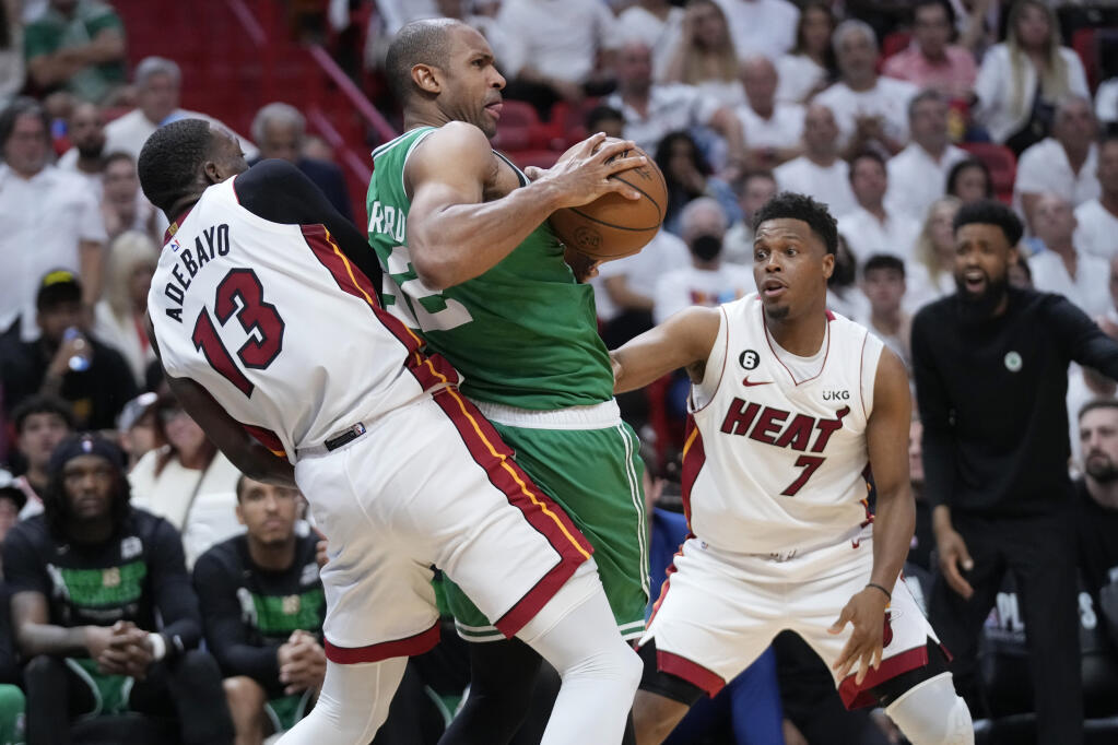 Heat center Bam Adebayo, left, and guard Kyle Lowry defend Boston Celtics center Al Horford during the second half of Game 4 during the NBA Eastern Conference finals, Tuesday, May 23, 2023, in Miami. (Wilfredo Lee / ASSOCIATED PRESS)