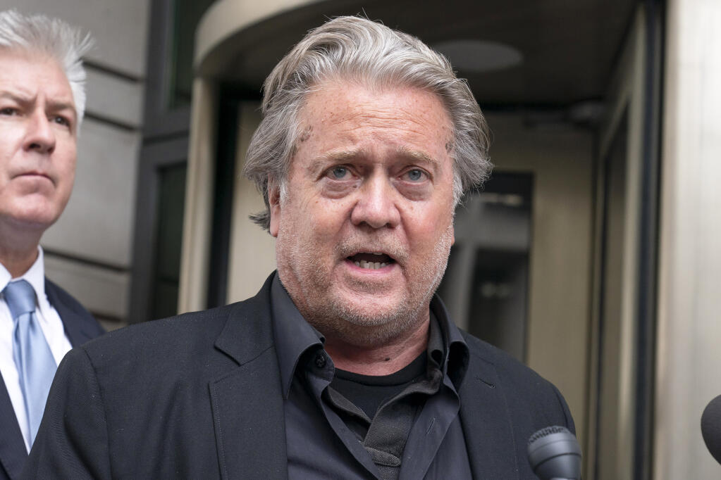 Steve Bannon speaks to the media as he departs the federal court in Washington, Thursday, July 21, 2022. Bannon was brought to trial on a pair of federal charges for criminal contempt of Congress after refusing to cooperate with the House committee investigating the U.S. Capitol insurrection on Jan. 6, 2021. (AP Photo/Jose Luis Magana)