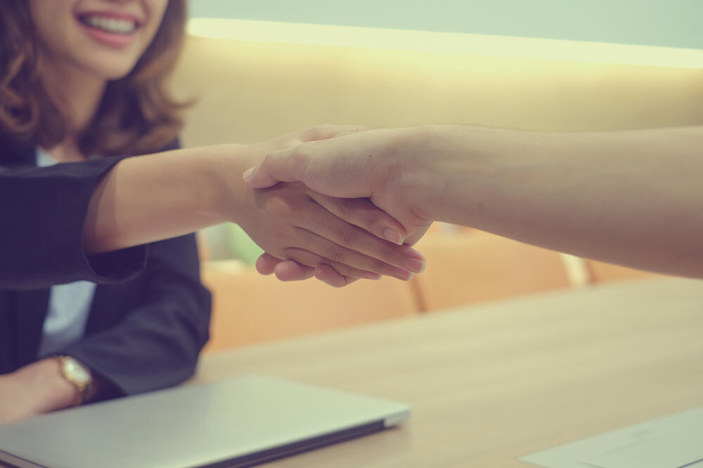 close up businesswoman handshake with partner,ceo leader hand shake for agreement or approve or deal financial,we are hiring concept