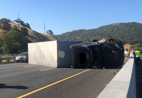 An overturned big rig on northbound Highway 101 near the Sonoma-Marin county line on Friday, July 15, 2022. (CHP - Santa Rosa / Twitter)