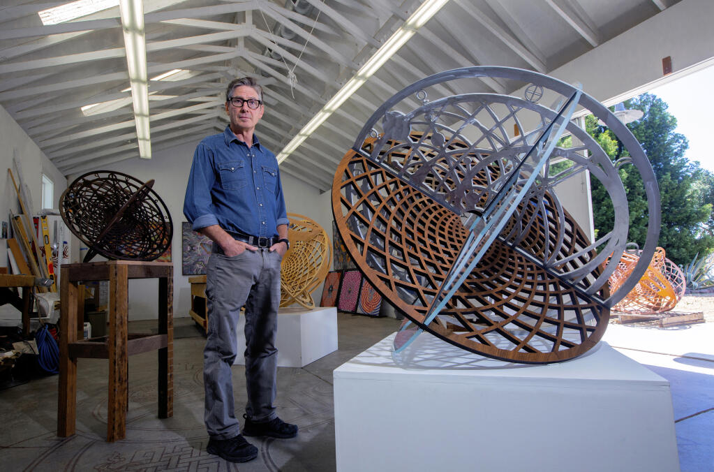 Artist Peter Hassen with a few of his metal sculptures in his Sonoma studio on Wednesday, June 23, 2021. (Photo by Robbi Pengelly)