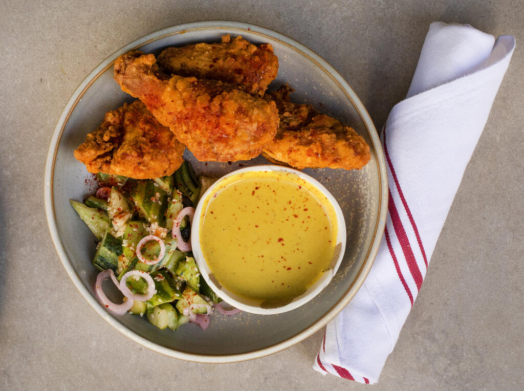 Fried chicken with cucumber and coconut peanut curry from Valley Bar + Bottle  in Sonoma. (John Burgess/The Press Democrat)