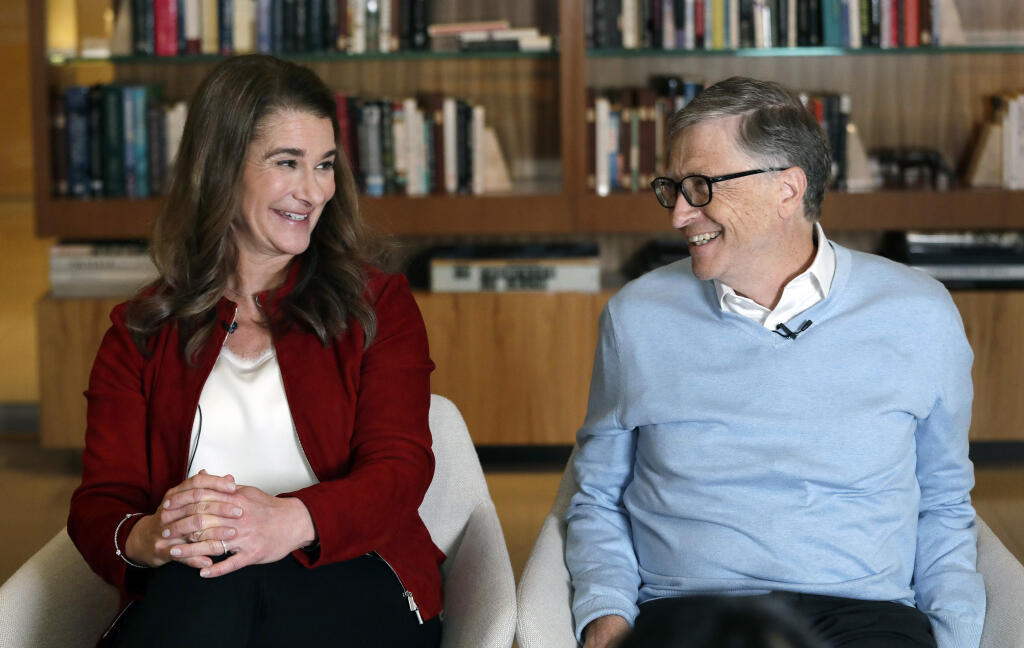 FILE--In this Feb. 1, 2019, file photo, Bill and Melinda Gates look toward each other and smile while being interviewed in Kirkland, Wash.   (AP Photo/Elaine Thompson, File)