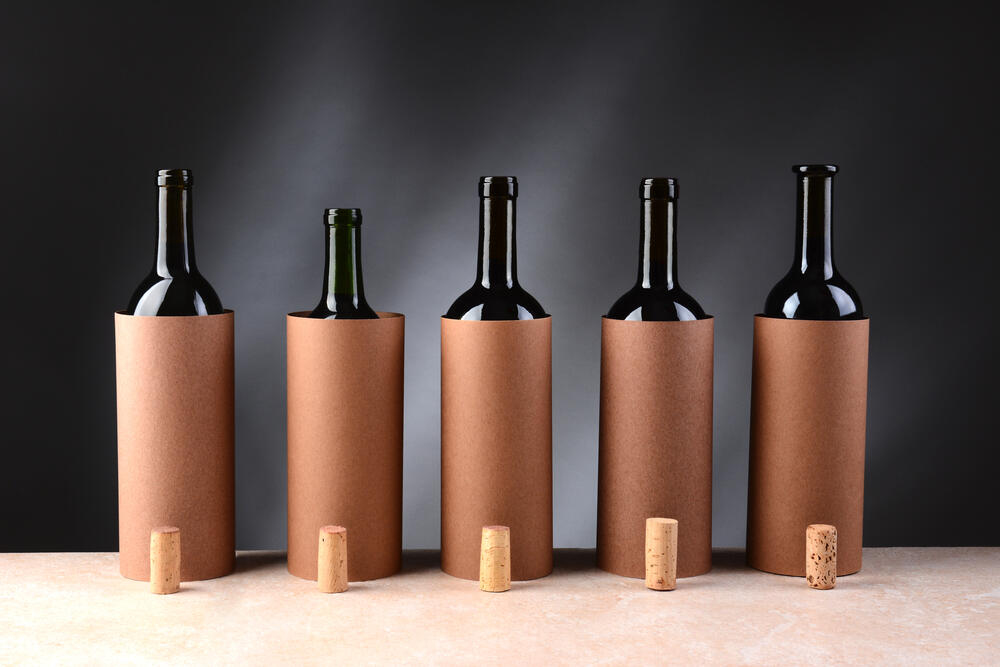Five different wine bottles set up for a blind wine tasting. Copyright (c) 2014 Steve Cukrov/Shutterstock