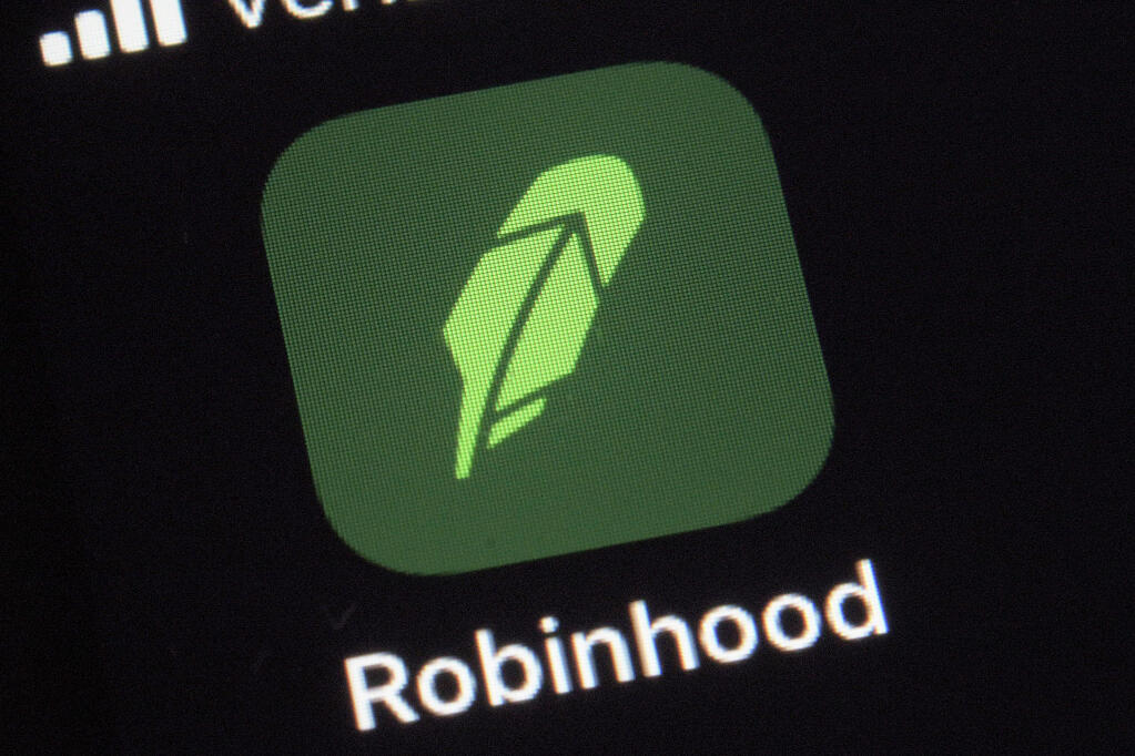 FILE - This Dec. 17, 2020, photo shows the logo for the Robinhood app on a smartphone in New York. (AP Photo/Patrick Sison, File)