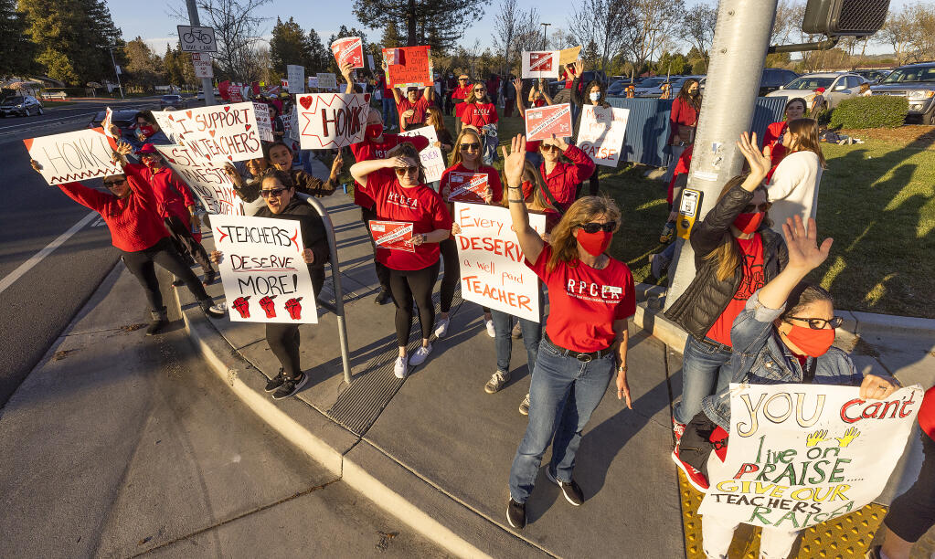Teachers, parents and students protested for increased wages in front of Rancho Cotate High School where the school board was meeting on Tuesday, March 8, 2022. (John Burgess / The Press Democrat)