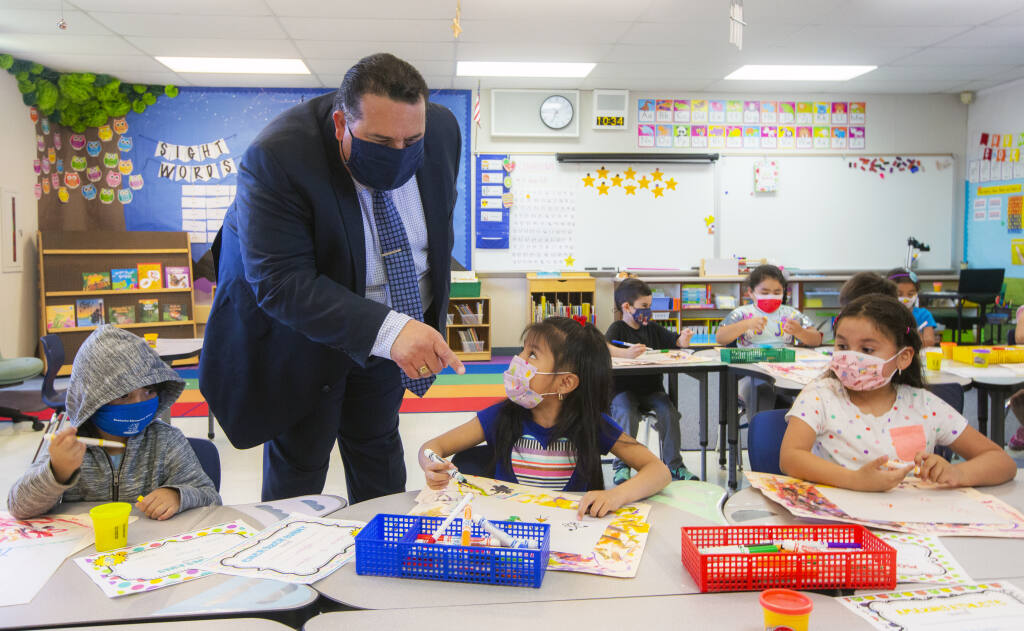On his first official day as the Sonoma Valley Unified School District superintendent, Adrian Palazuelos took a tour of valley schools. Dropping into Sassarini Elementary School, on Fifth Street West, he chatted with kindergarten students about their artwork on Tuesday, June 1, 2021. (Photo by Robbi Pengelly/Index-Tribune)