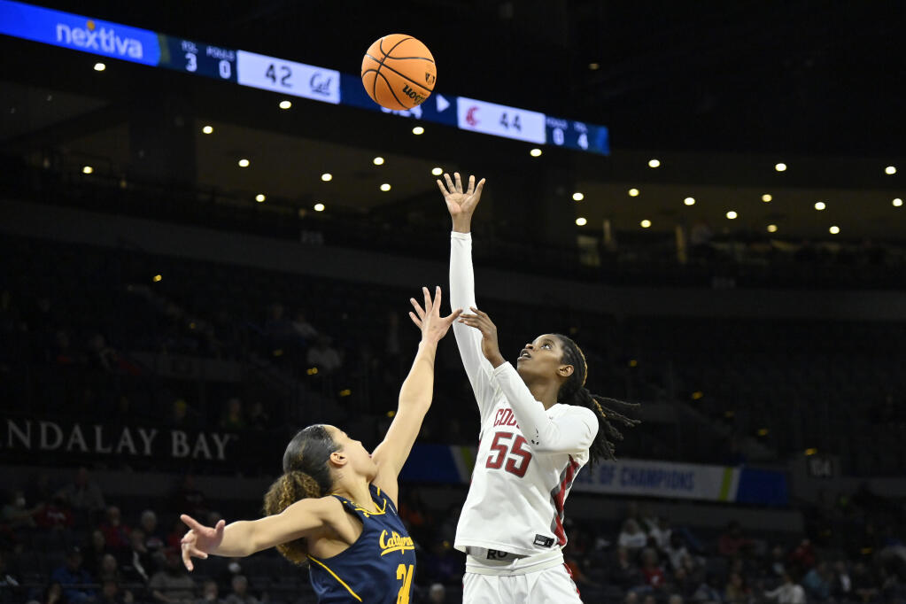 Washington State center Bella Murekatete shoots against Cal forward Evelien Lutje Schipholt during the second half Wednesday in the first round of the Pac-12 women’s tournament in Las Vegas. (David Becker / ASSOCIATED PRESS)