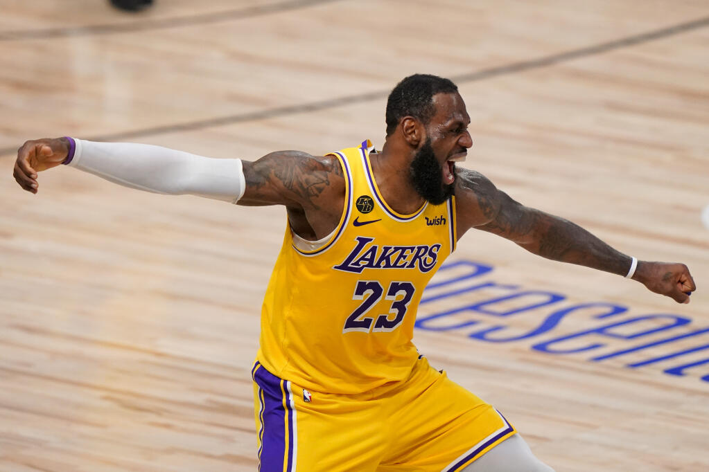 Los Angeles Lakers forward LeBron James celebrates during the second half in Game 4 of the NBA Finals against the Miami Heat Tuesday, Oct. 6, 2020, in Lake Buena Vista, Florida. (Mark J. Terrill / ASSOCIATED PRESS)