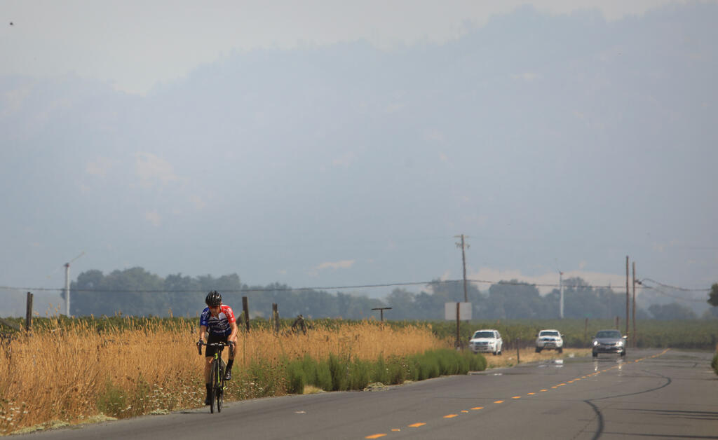 The Mayacamas Mountains above Alexander Valley are barely visible due the smoke from numerous wildfires in the region, Monday, Aug. 31, 2020 in Healdsburg.  (Kent Porter / The Press Democrat)