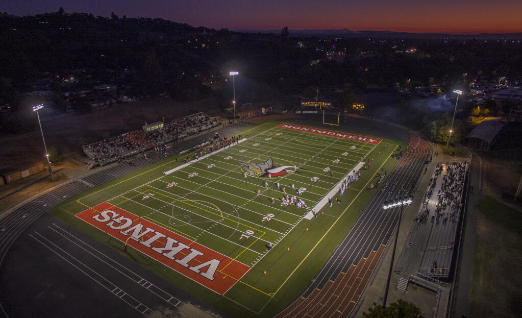 The sun sets just after halftime during Montgomery’s home opener against Ukiah at Montgomery High School, Friday Aug. 26, 2022. (Chad Surmick / The Press Democrat)