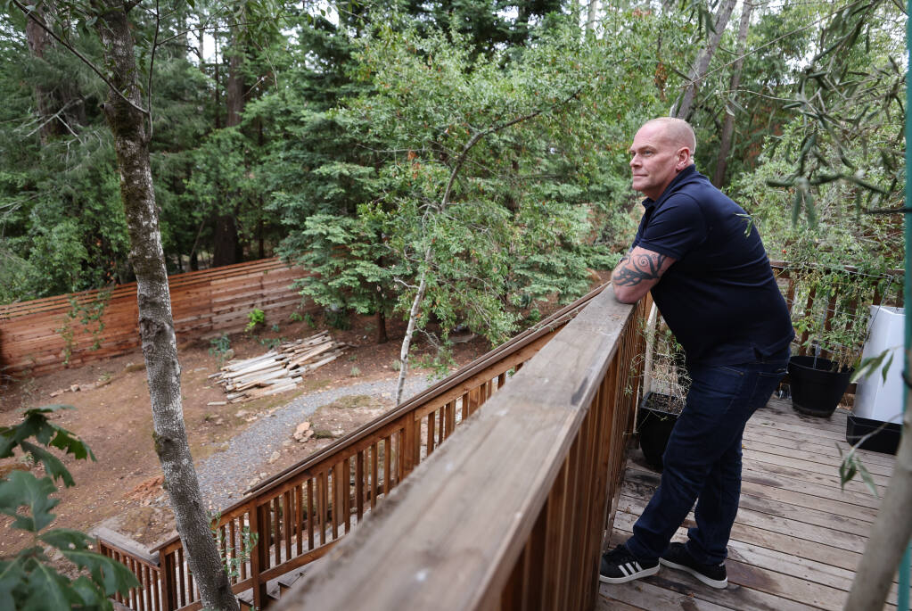 Dale Sessions is advocating for regulations on short term rentals because of a problematic party house next-door to his home in Santa Rosa. Sessions built a tall fence to try to block some of the noise from parties held at the short term rental property.  (Christopher Chung/ The Press Democrat)