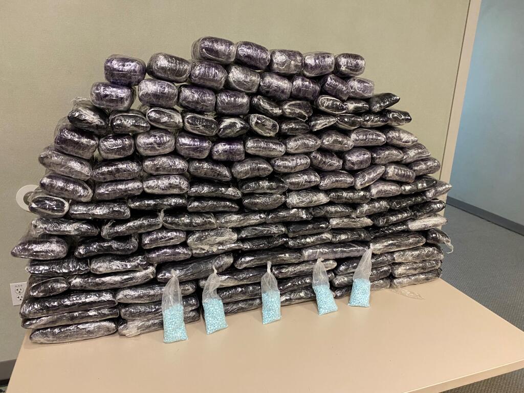 This undated photo provided by the U.S. Drug Enforcement Administration, Los Angeles Field Division, shows some of the seized approximately 1 million fake pills containing fentanyl that were seized when agents served a search warrant, July 5, 2022, at a home in Inglewood, Calif. (DEA via AP)
