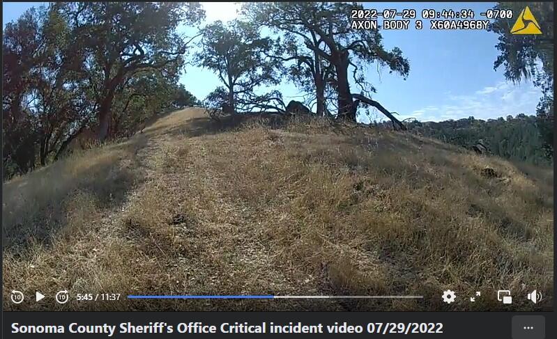 A still shot from a critical incident video connected to the July 29 deputy-involved fatal shooting of a David Pelaez-Chavez in unincorporated Geyersville. The Sonoma County Sheriff’s Office released the video Sunday. From the body camera of Deputy Anthony Powers, Pelaez-Chavez can be seen in the distance leaning against a tree. (Sonoma County Sheriff’s Office)