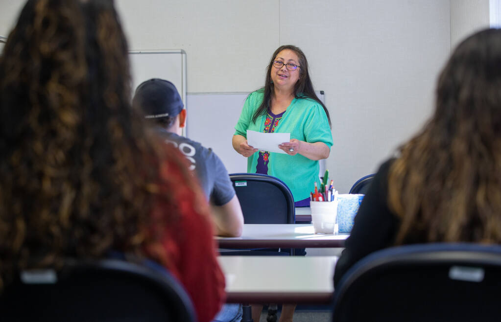 Literacyworks Recruiter and SRJC Outreach Specialist Enedina Vera discusses scholarship requirements with Literacyworks scholarship winners during a meeting, Tuesday, March 7, 2023, in Santa Rosa. (Chad Surmick / The Press Democrat)