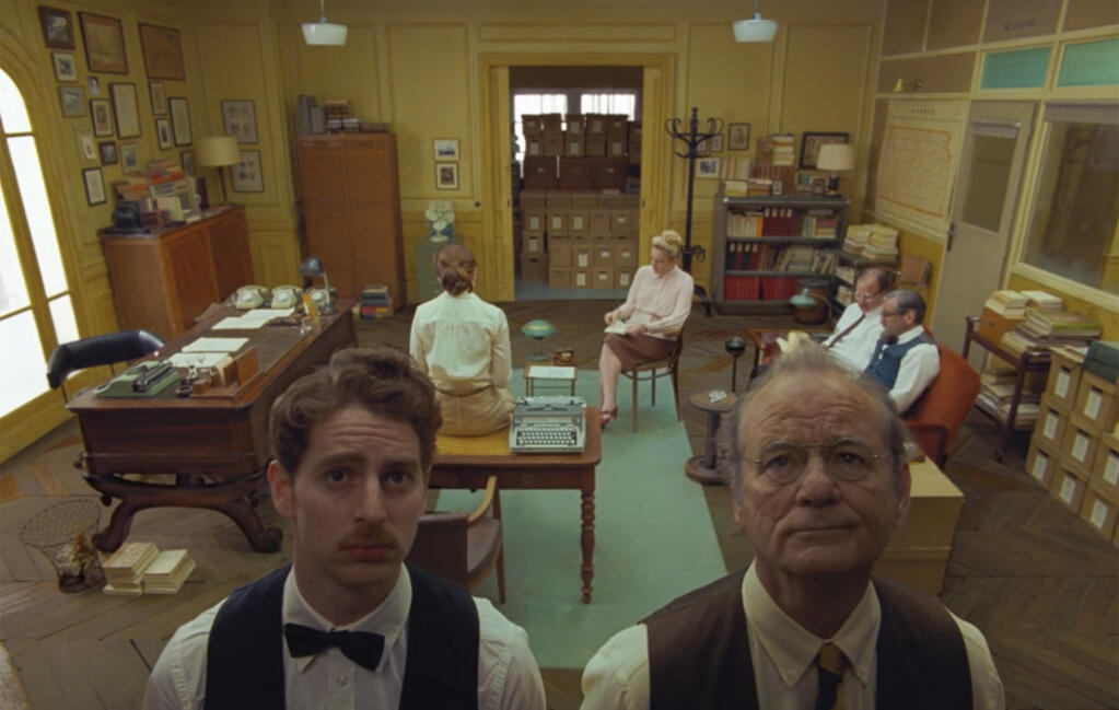 Bill Murray, right, leads a newsroom at a New Yorker-style magazine in ‘The French Dispatch.’