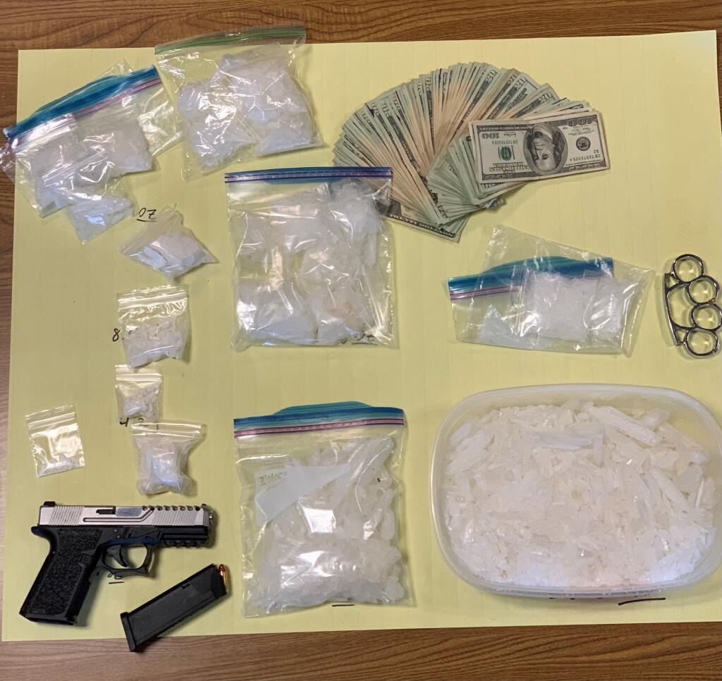 This image shows drugs and a gun confiscated by Santa Rosa police on Monday, Jan. 10, 2022, during a drug trafficking investigation. (Santa Rosa Police Department)