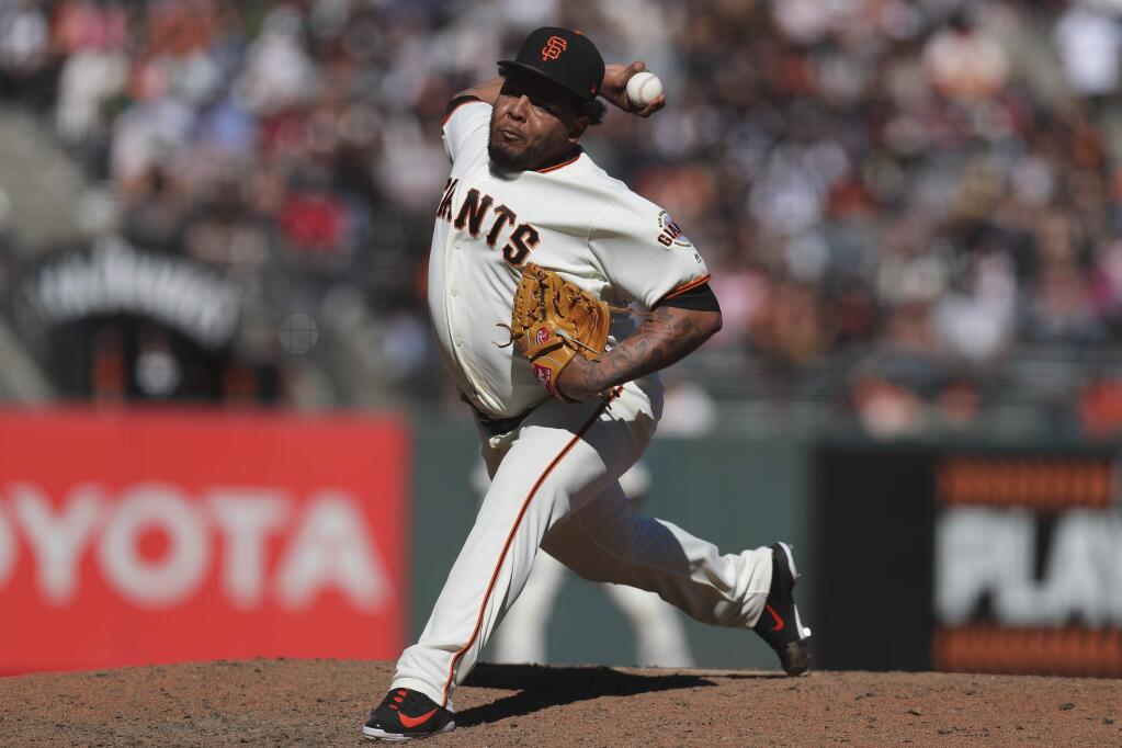 San Francisco Giants relief pitcher Reyes Moronta throws in the ninth inning against the Colorado Rockies in a baseball game in San Francisco, Sunday, Sept. 16, 2018. (AP Photo/Scot Tucker)