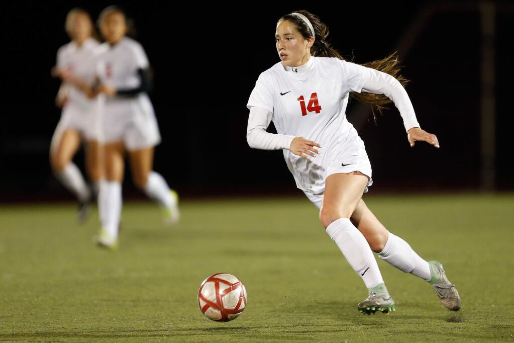 Montgomery's Cindy Arteaga (14) takes the ball downfield during the NCS girls soccer semifinal match between Livermore and Montgomery high schools in Santa Rosa, California, on Wednesday, February 21, 2018. (Alvin Jornada / The Press Democrat)