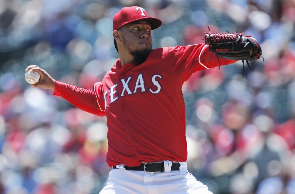 Texas Rangers starting pitcher Yovani Gallardo delivers to the Oakland Athletics during the first inning of a baseball game, Sunday, May 3, 2015, in Arlington, Texas. (AP Photo/Jim Cowsert)