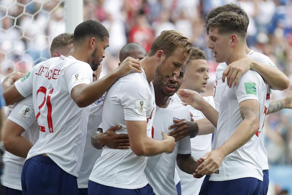 England players celebrate after their teammate Harry Kane, center, scored their side's fith goal during the group G match between England and Panama at the 2018 soccer World Cup at the Nizhny Novgorod Stadium in Nizhny Novgorod , Russia, Sunday, June 24, 2018. (AP Photo/Antonio Calanni)
