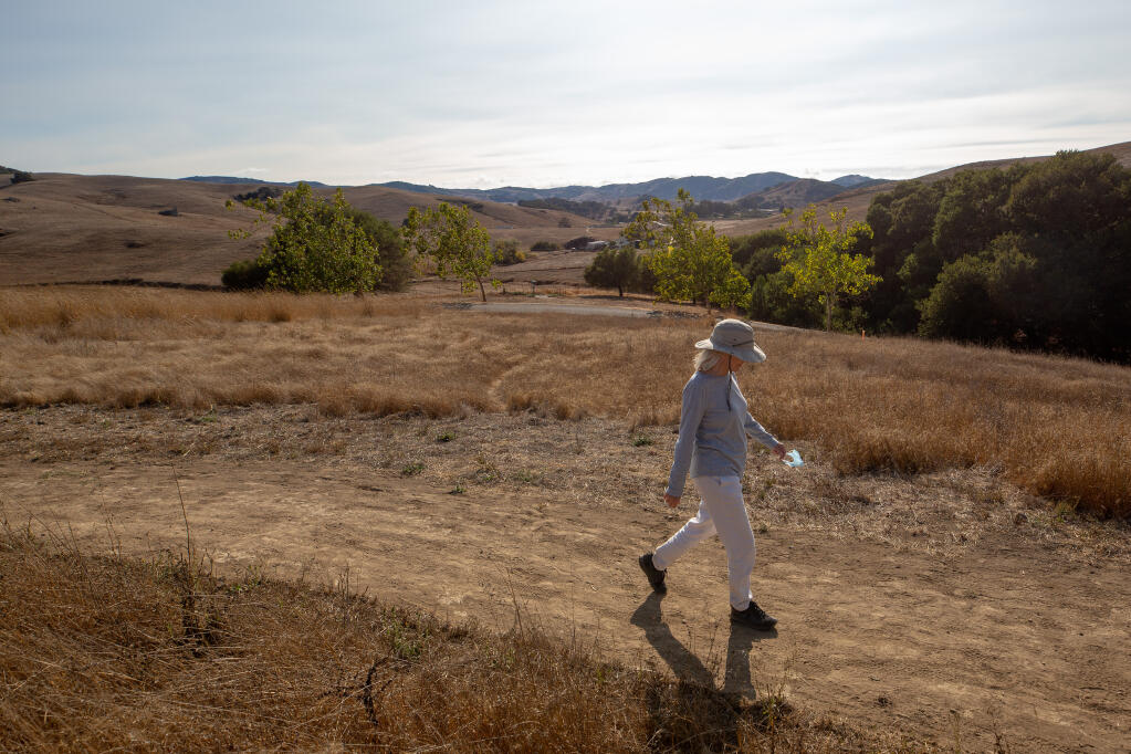 Jennifer Laporte of Petaluma enjoys the first hike she's had in weeks at Helen Putnam Regional Park due to previously poor air quality in Petaluma on Wednesday, Sept. 16, 2020. (Alvin A.H. Jornada / The Press Democrat)