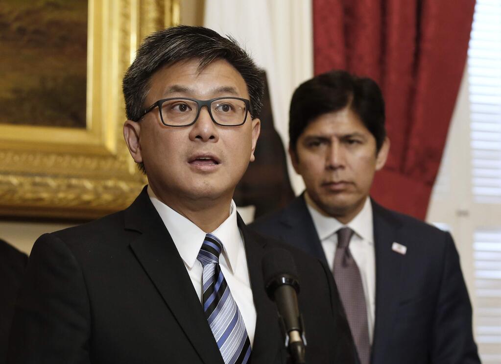 State Treasurer John Chiang, left, says he will join with Senate President Pro Tem Kevin de Leon, D-Los Angeles, right, in moving forward on de Leon's plan to automatically enroll private-sector workers in state run retirement plans, during a news conference,Thursday, May 18, 2017, in Sacramento, Calif. The Secure Choice Plan, signed into law by Go. Jerry Brown last November, could be challenged in court after Congress revoked a legal safe-haven created by former President Barack Obama. (AP Photo/Rich Pedroncelli)