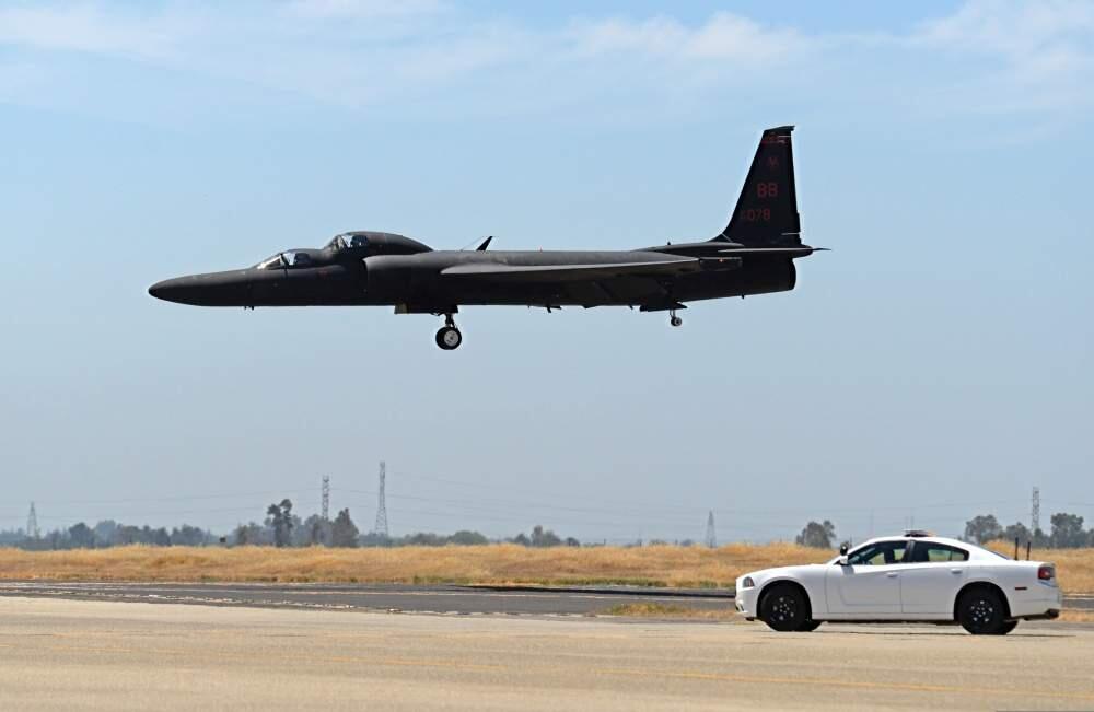 A chase car pursues a U-2 Dragon Lady as the aircraft prepares to land at Beale Air Force Base. Mobile chase cars guide the aircraft during takeoffs and landings. (Airman 1st Class Ramon A. Adelan / U.S. Air Force, June 16, 2015)