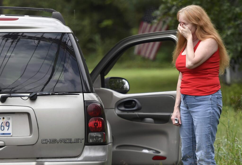Shirley Pollack, of Perryville, Md. reacts to what authorities have called a shooting with multiple victims in Perryman, Md. on Thursday, Sept. 20, 2018. Authorities say multiple people have been shot in northeast Maryland in what the FBI is describing as an 'active shooter situation.' Pollack,was concerned about her son who worked near the scene of the shooting. (AP Photo/Steve Ruark)