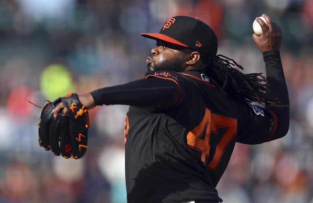 In this July 28, 2018, file photo, San Francisco Giants pitcher Johnny Cueto works against the Milwaukee Brewers in the first inning in San Francisco. Cueto is scheduled to throw next week for the first time since undergoing Tommy John reconstructive surgery in August. (AP Photo/Ben Margot, File)