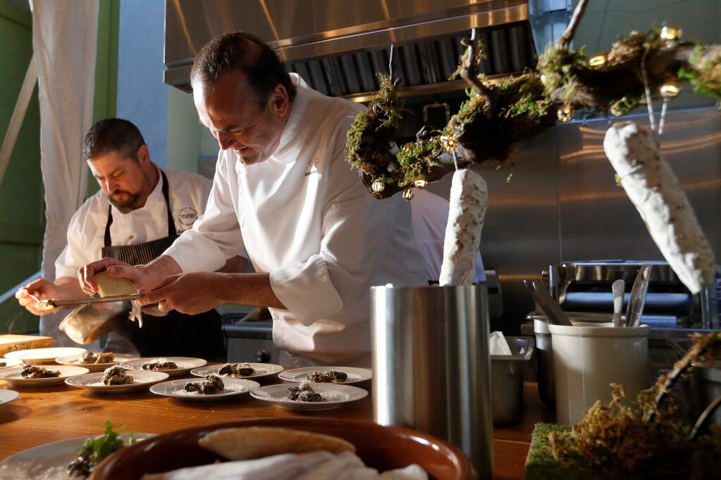 Chefs Charlie Palmer, right, Scott Romano finish plates of Bucher pinot noir pork shoulder for guests during Pigs and Pinot at Hotel Healdsburg, in Healdsburg, California, on Friday, March 16, 2018. (Alvin Jornada / The Press Democrat)