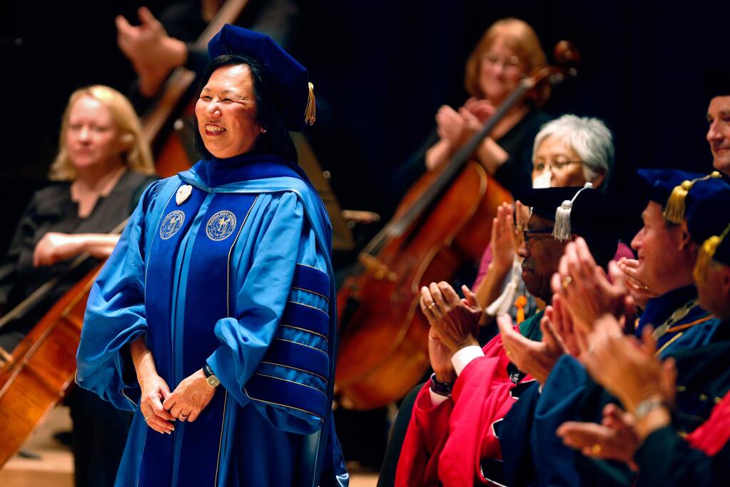 Audience members applaud Sonoma State University president Dr. Judy K. Sakaki as she takes her seat during an investiture for Dr. Sakaki in Weill Hall at Sonoma State University, in Rohnert Park, California, on Thursday, April 20, 2017. (Alvin Jornada / The Press Democrat)