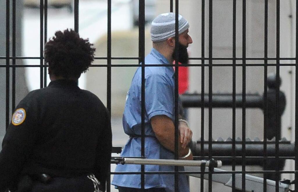Adnan Syed enters Courthouse East in Baltimore prior to a hearing on Wednesday, Feb. 3, 2016 in Baltimore. The hearing, scheduled to last three days before Baltimore Circuit Judge Martin Welch, is meant to determine whether Syed's conviction will be overturned and case retried. (Barbara Haddock Taylor/The Baltimore Sun via AP)