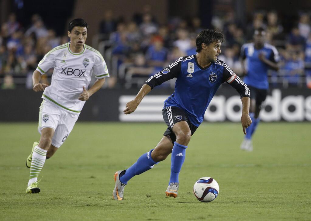 In this Sept. 12, 2015, file photo, San Jose Earthquakes forward Chris Wondolowski, right, dribbles against the Seattle Sounders during the first half of an MLS soccer match in San Jose. Wondolowski didn't have to travel far when he got the call up to the U.S. national team ahead of two key World Cup qualifiers. The U.S. will be playing Honduras on Wondolowski's home field for the San Jose Earthquakes on Friday night, March 24, as the Americans look to bounce back from an 0-2 start in the final round of qualifying in the North and Central American and Caribbean region's final round. (AP Photo/Jeff Chiu, File)