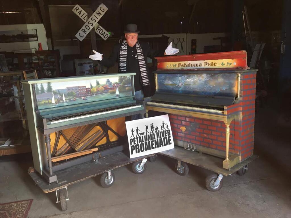 Brenda L. Maher John Maher shows off a piano, at left, painted by Nancy Lloyd that will be on display in the Petaluma Textile & Design window, and one painted by Evelyn Dolowitz Nitzberg that is earmarked for the Blush beauty boutique showroom window.