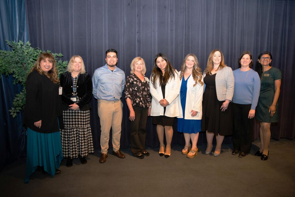 Dr. Tami Hendriksz, from left, Dr. Lisa Norton and Steward Pimienta from Travis Credit Union, JoAnn Munski from NorthBay Health, scholarship winners Jill Cac and Tayler Tildsley, Heather Resseger from NorthBay Health, Michelle Sabolich from Travis Credit Union and Dr. Prabjot “Jodie” Sandhu from Touro University California gather on March 7, 2024, at an event to honor Cac and Tildsley. (Courtesy of Touro University California)
