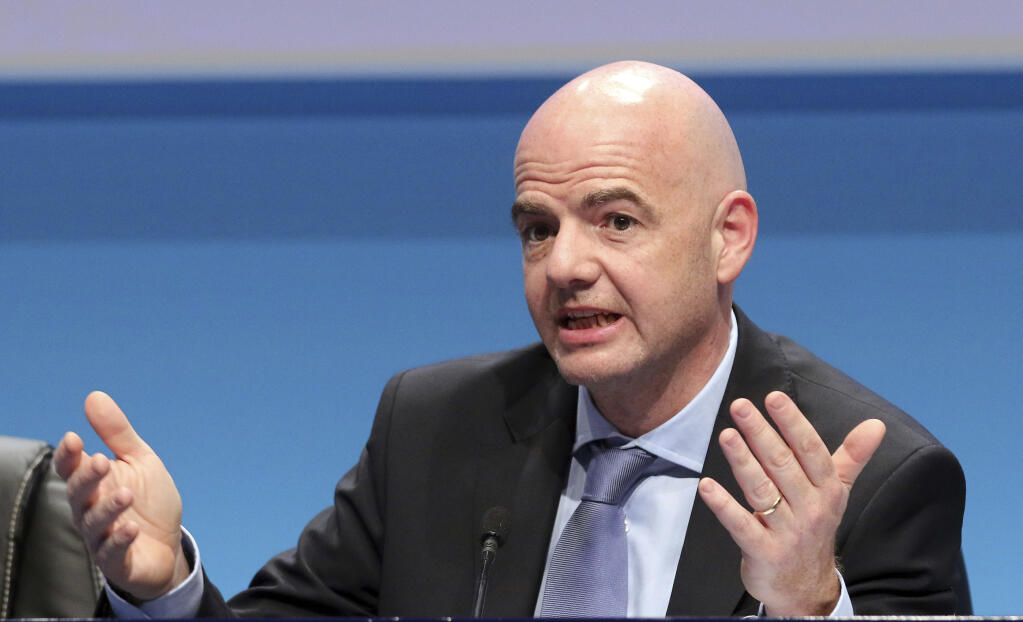 FILE - UEFA Secretary General Gianni Infantino speaks during a news conference at the end of the 39th Ordinary UEFA Congress in Vienna, Austria, on March 24, 2015. The last 32-team World Cup will be the shortest  in this era. There are just 28 days from starting on Nov. 21 in Qatar to finishing on Dec. 18. And only 25 days to play seven games if a team from Groups G or H – like Brazil or Portugal – is to reach the final after opening on Nov. 24. (AP Photo/Ronald Zak, File)