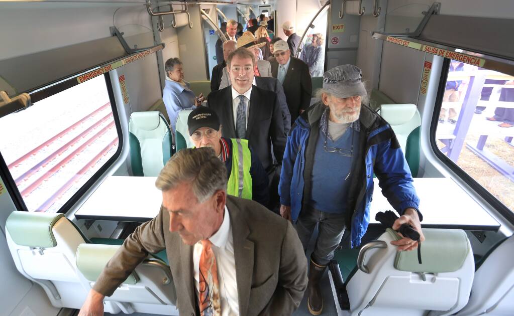 On display for the first time, a SMART commuter train coach is toured by dignitaries and the general public, Tuesday April 7, 2015 during the official unveiling at the Cotati train depot of the rail cars. (Kent Porter / Press Democrat) 2015