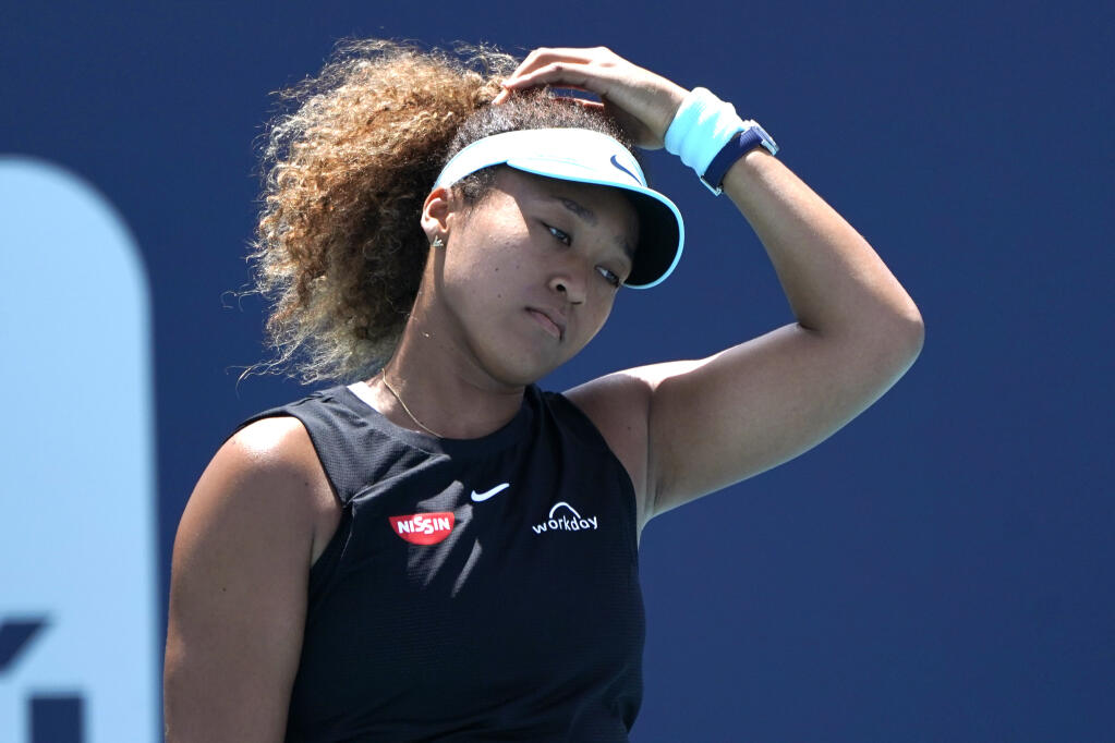 Naomi Osaka reacts during her match against Maria Sakkari in the quarterfinal round of the Miami Open in Miami Gardens, Florida, on Wednesday, March 31, 2021. (Lynne Sladky / ASSOCIATED PRESS)