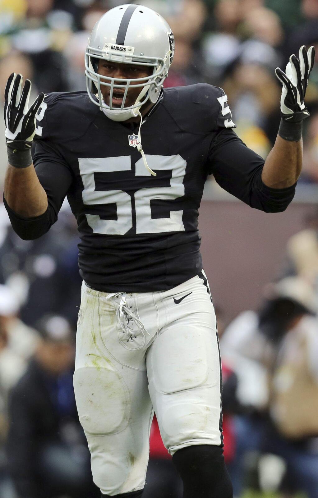 Raiders linebacker and defensive end Khalil Mack was credited with 77 tackles and 15 sacks in 2015 as well as two forced fumbles. (Ryan Kang / Associated Press)