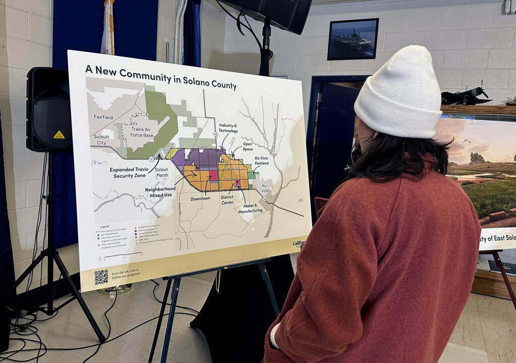 FILE - A map of a new proposed community in Solano County, Calif., is displayed during a news conference in Rio Vista, Calif. on Jan. 17, 2024. A billionaire-backed proposal to build an eco-friendly California city from scratch is off to a bumpy start in qualifying its voter initiative for the Nov. 5 ballot. The deadline for the Solano County counsel's office to give California Forever the ballot title they need to start gathering signatures is Thursday, Feb. 29. (AP Photo/Janie Har, File)