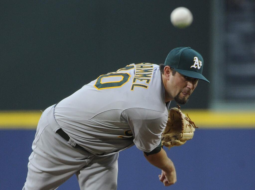 Oakland Athletics starting pitcher Jason Hammel delivers to the Atlanta Braves during the first inning of a baseball game against the Oakland Athletics Friday, Aug. 15, 2014, in Atlanta. (AP Photo/David Tulis)