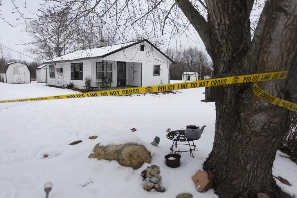 Police tape surrounds one of five crime scenes near Tyrone, Mo., on Friday morning, Feb. 27, 2015. A gunman killed seven people and wounded an eighth person in an overnight house-to-house rampage in the small town in the Missouri Ozarks before apparently committing suicide in a vehicle, authorities said Friday. The victims were found in four homes in Tyrone, about 40 miles north of the Arkansas line. The 36-year-old gunman was discovered in a neighboring county, dead of what appeared to be a self-inflicted gunshot wound, Missouri Highway Patrol Sgt. Jeff Kinder said. (AP Photo/The Springfield News-Leader, Nathan Papes) NO SALES