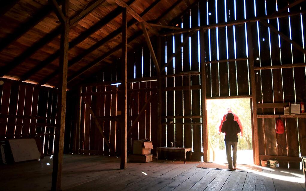Betty and Jim Doerksen of Rancho Mark West, exit Sonoma County's oldest barn, Monday Oct. 26, 2015 in Santa Rosa. (Kent Porter / Press Democrat) 2015
