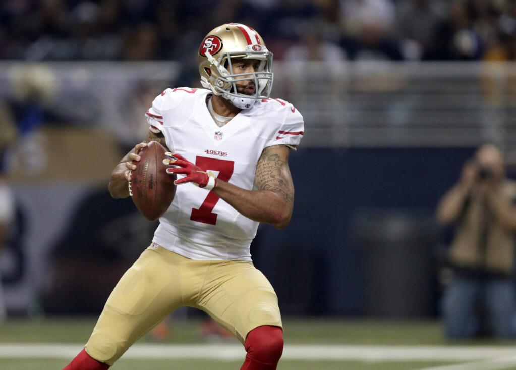 FILE - In this Nov. 1, 2015, file photo, San Francisco 49ers quarterback Colin Kaepernick drops back to pass during an NFL football game against the St. Louis Rams in St. Louis. 49ers coach Chip Kelly said he talked to Kaepernick earlier this week and is staying hopeful the mobile quarterback will still be on San Franciscoís roster when the offseason program begins April 4. 'I'd love to have him. I'm a big Kap fan,' Kelly said Thursday, March 17, after Stanford's pro day.(AP Photo/Tom Gannam, File)