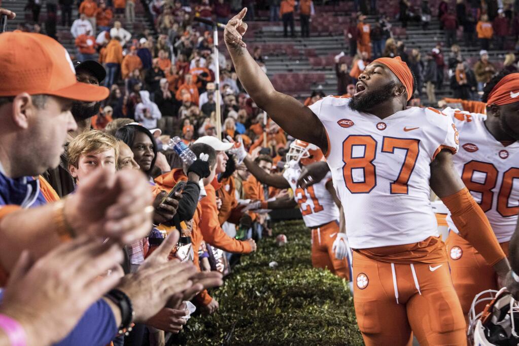 Clemson tight end D.J. Greenlee (87) celebrates in front of fans after a game against South Carolina on Saturday, Nov. 25, 2017, in Columbia, S.C. Clemson defeated South Carolina 34-10. (AP Photo/Sean Rayford)