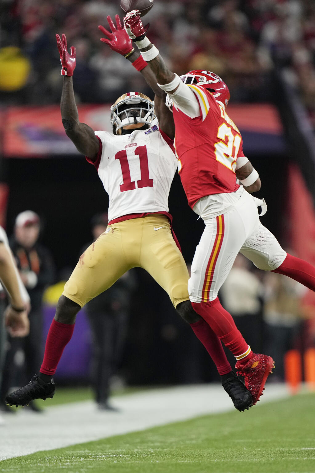 Kansas City Chiefs safety Mike Edwards (21) knocks away a pass to San Francisco 49ers wide receiver Brandon Aiyuk (11) during the NFL Super Bowl 58 football game Sunday, Feb. 11, 2024, in Las Vegas. The Chiefs defeated the 49ers 25-22 in overtime.(AP Photo/Doug Benc)