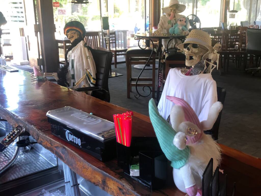 Two skeletons sit at the bar at Northwood Restaurant in Monte Rio. (Northwood Restaurant/Facebook)
