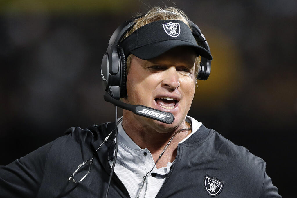 In this Aug. 10, 2018, file photo, then-Raiders coach Jon Gruden reacts during the first half of a preseason game against the Detroit Lions in Oakland. (John Hefti / ASSOCIATED PRESS)